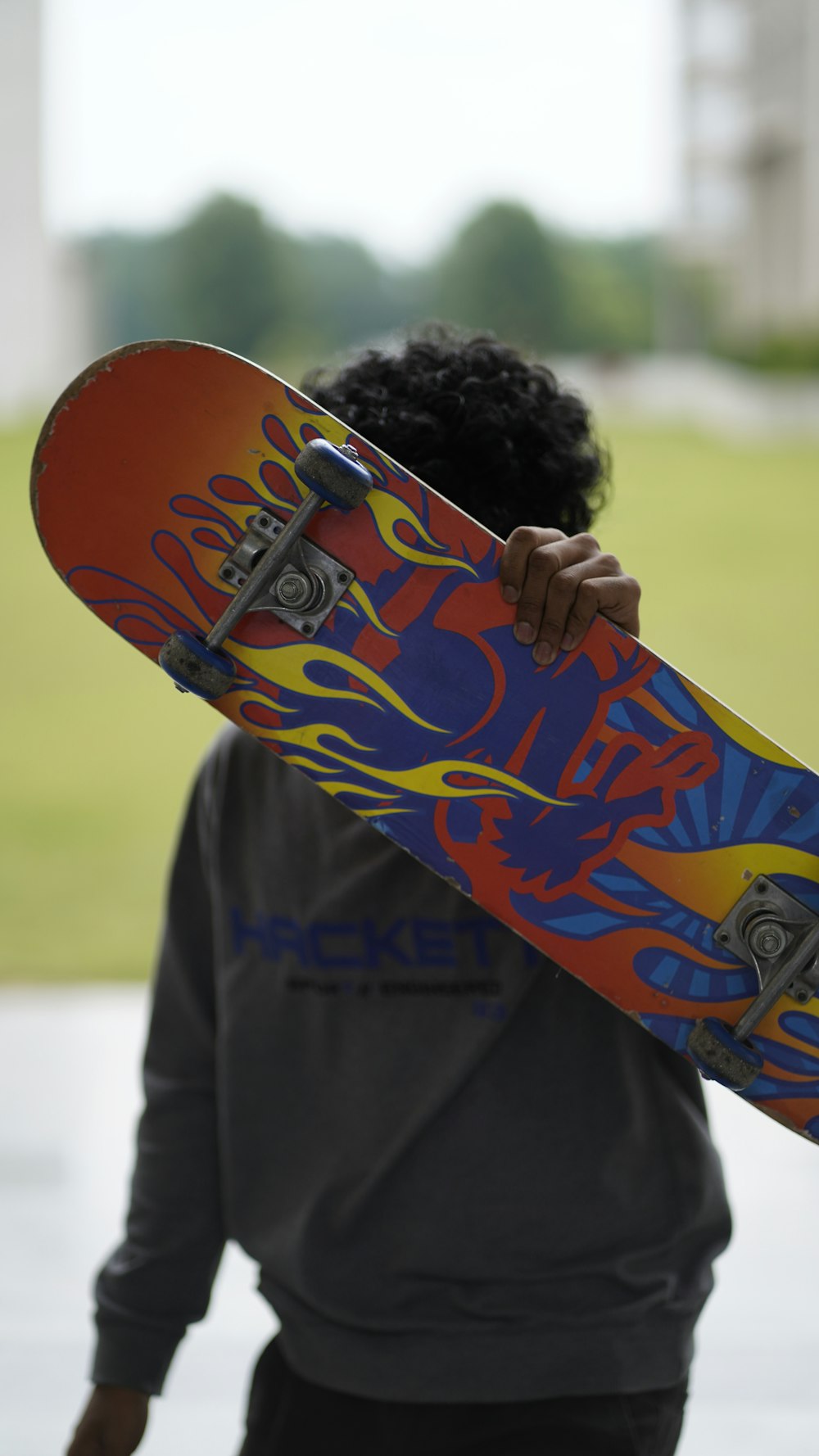 a person holding a skateboard