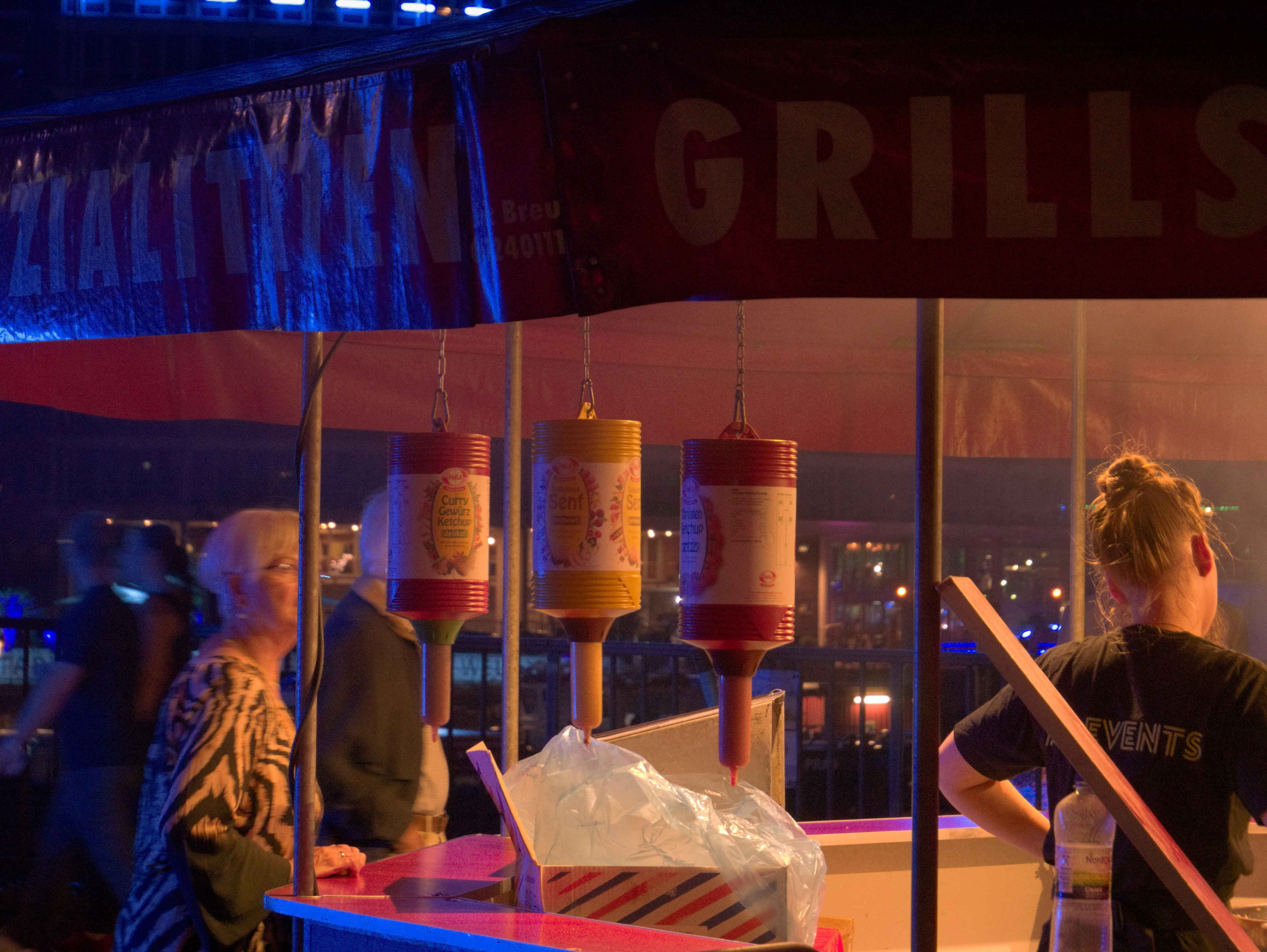 a person standing next to a table with cups on it