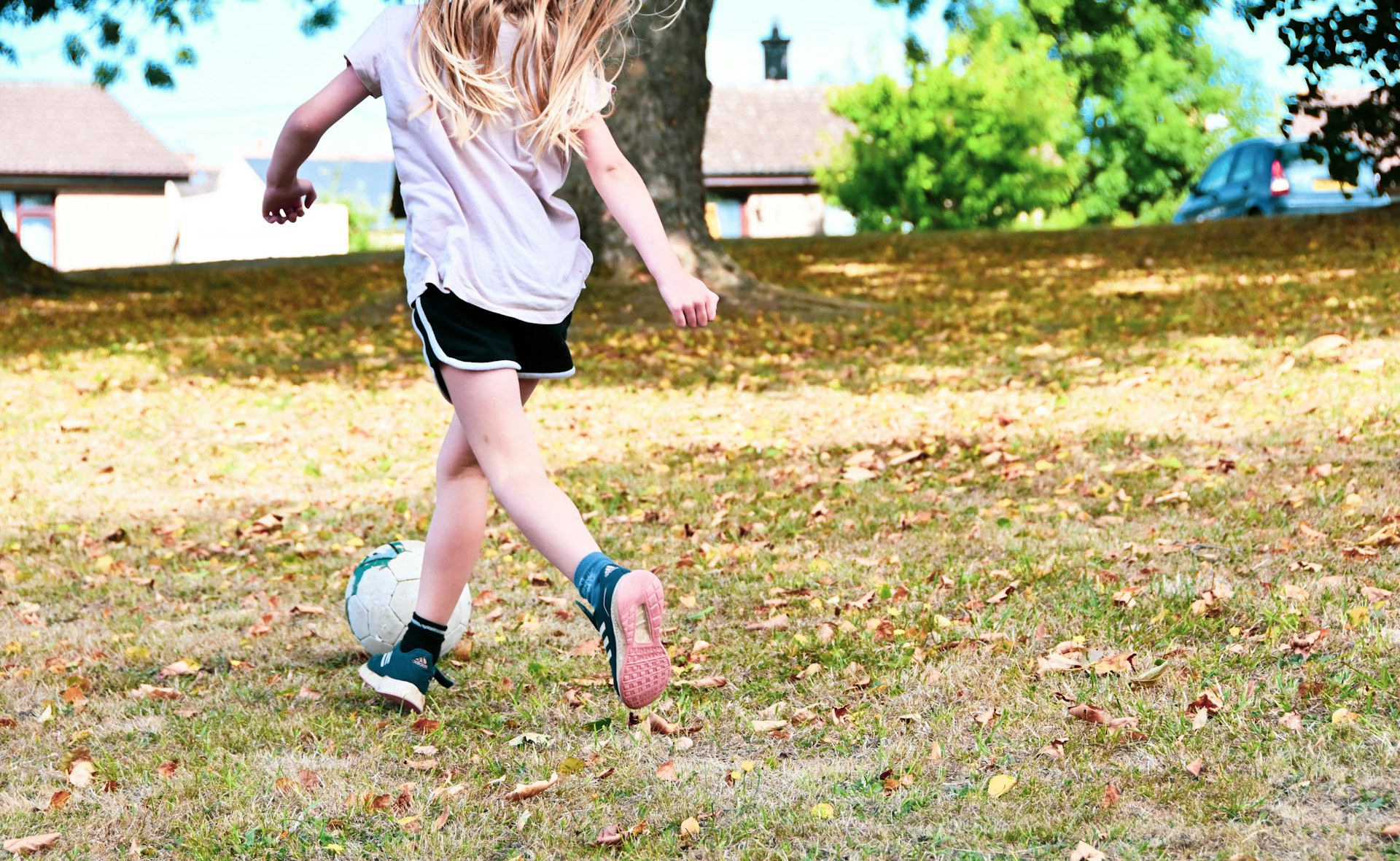 a girl running on grass