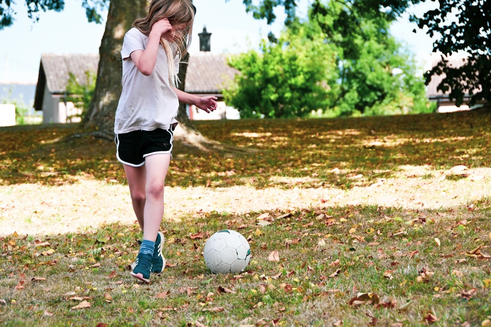 a person kicking a football ball