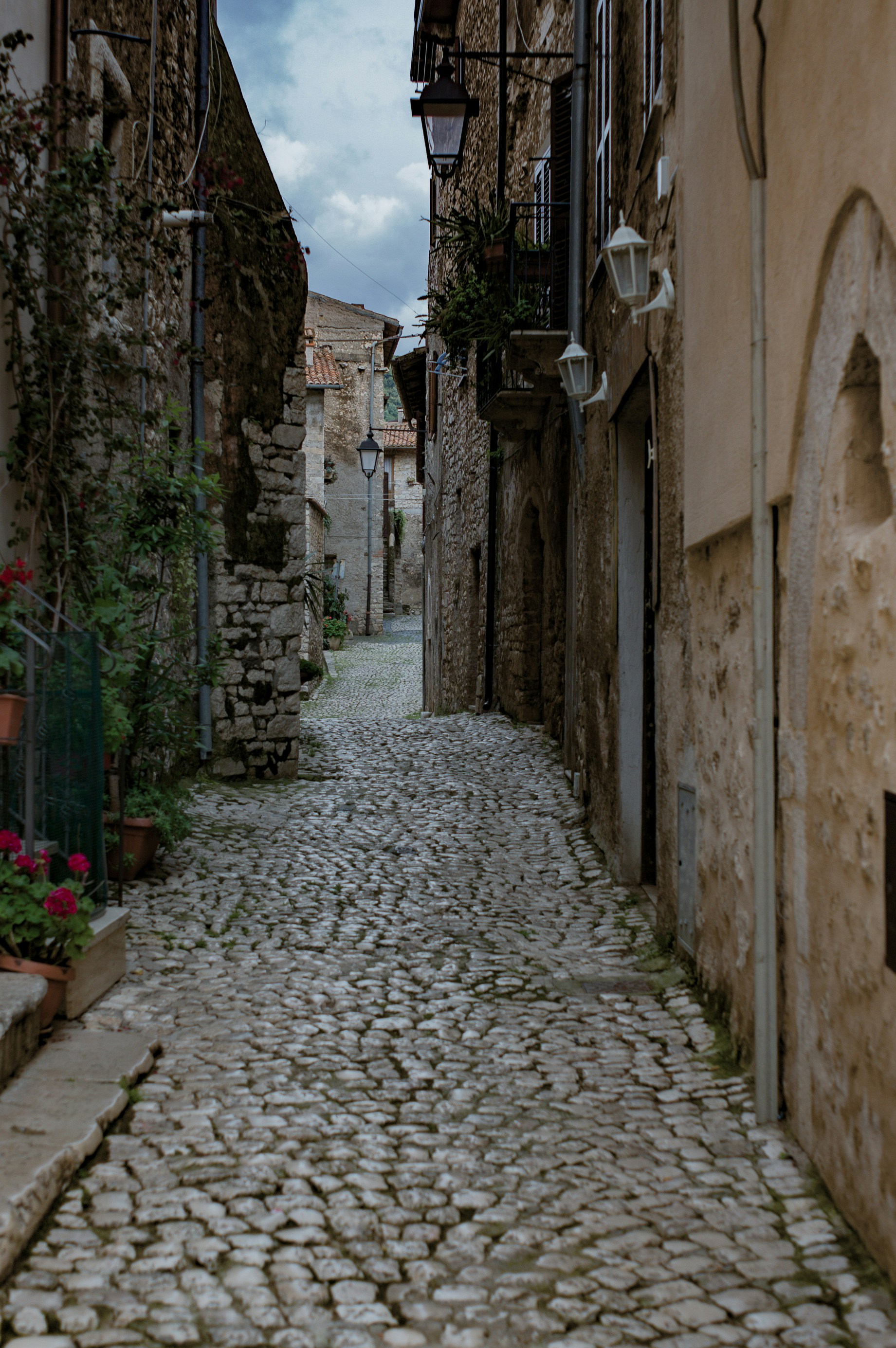Alley One of the narrow alleys of the old Sermoneta town in Italy. Unfortunately the weather was rather cloudy; this small town really shines when the weather is clear!