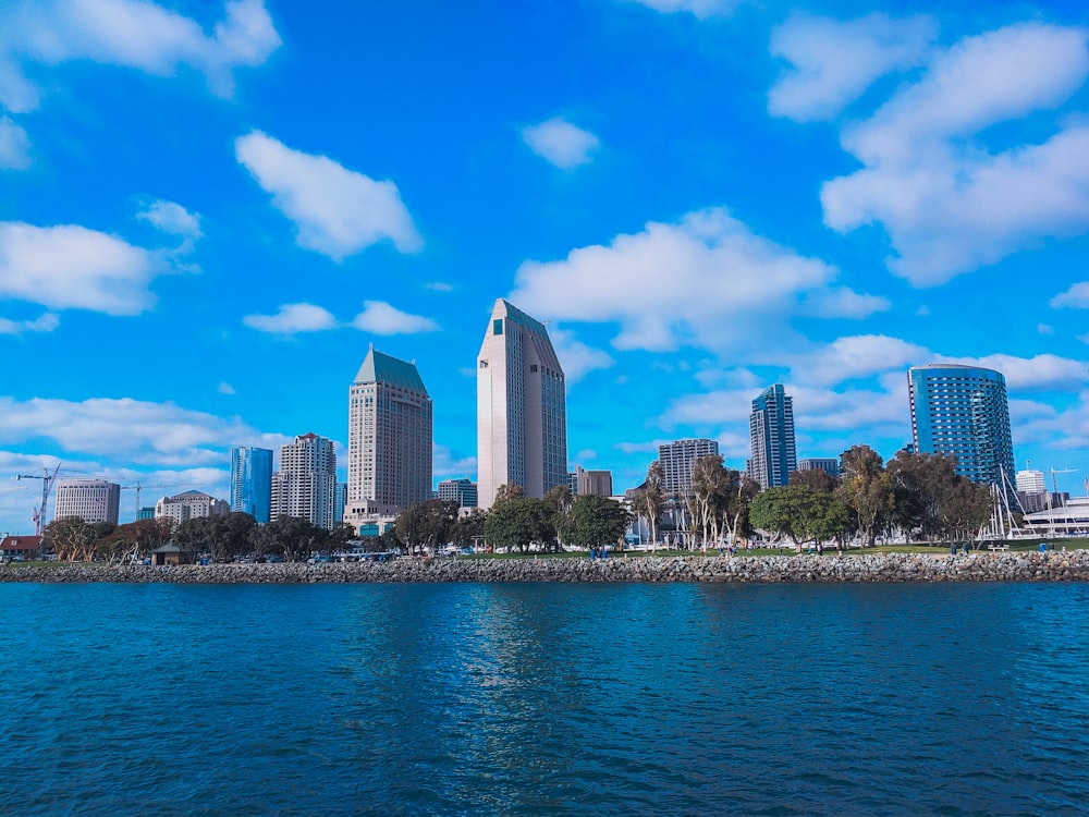 a body of water with a city in the background