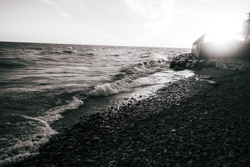 a rocky beach with waves crashing