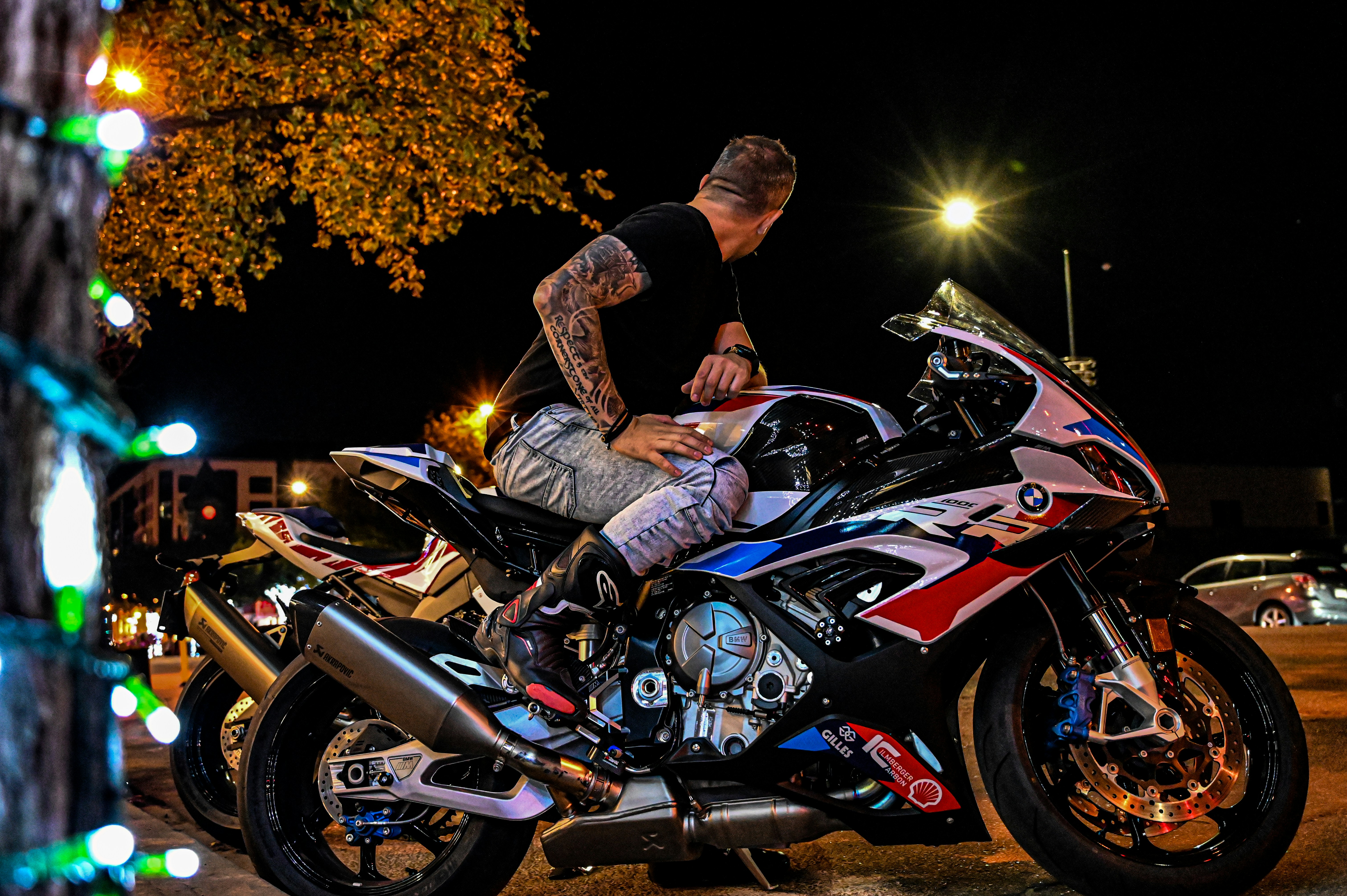 a man sitting on a motorcycle