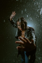 A cinematic poster featuring a dramatic rain streak effect symbolizing an upcoming film project.