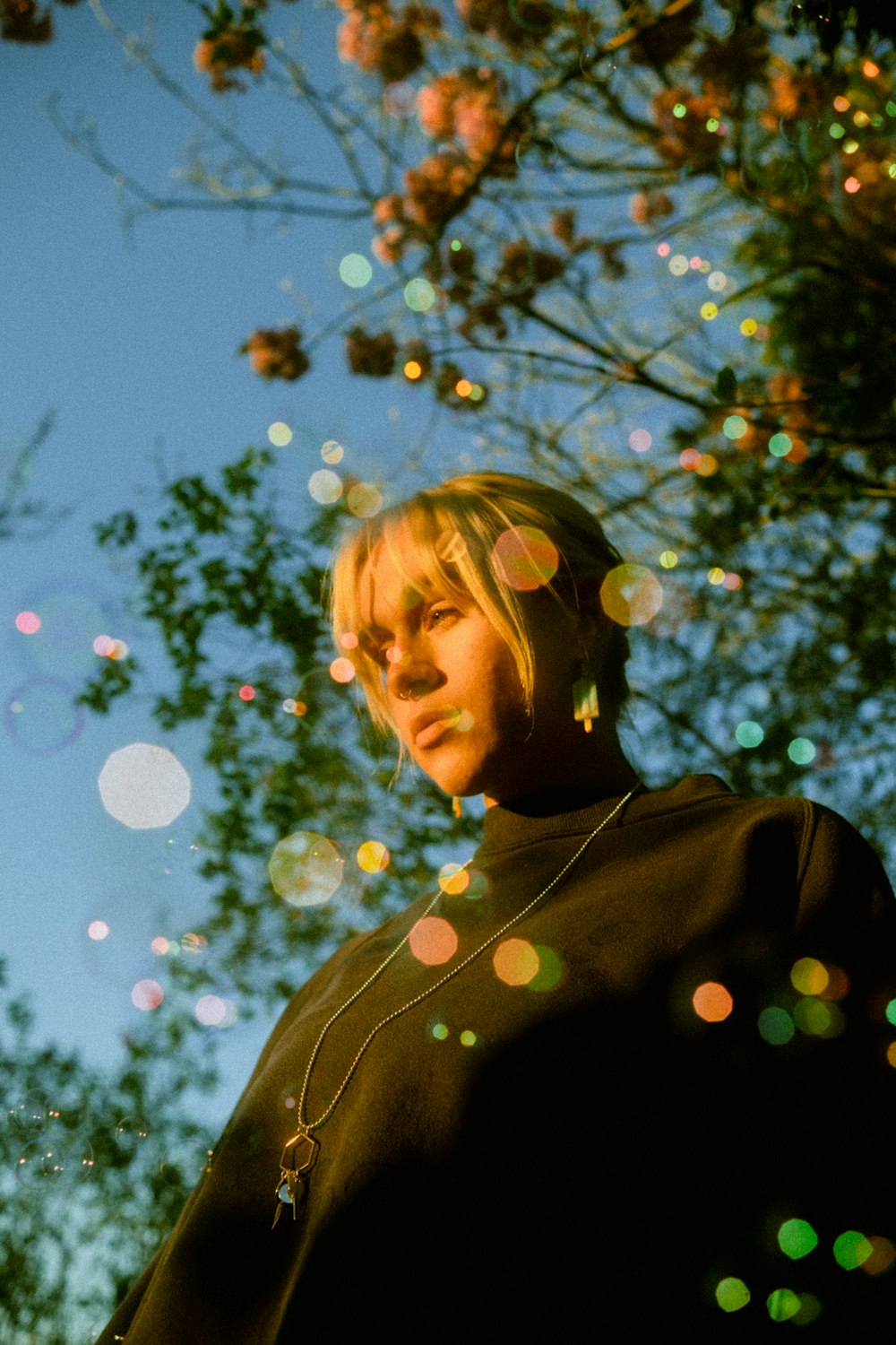 a person standing under a tree