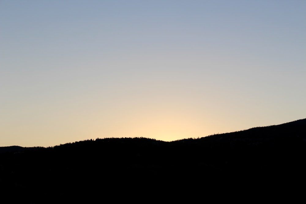 a hill with a blue sky