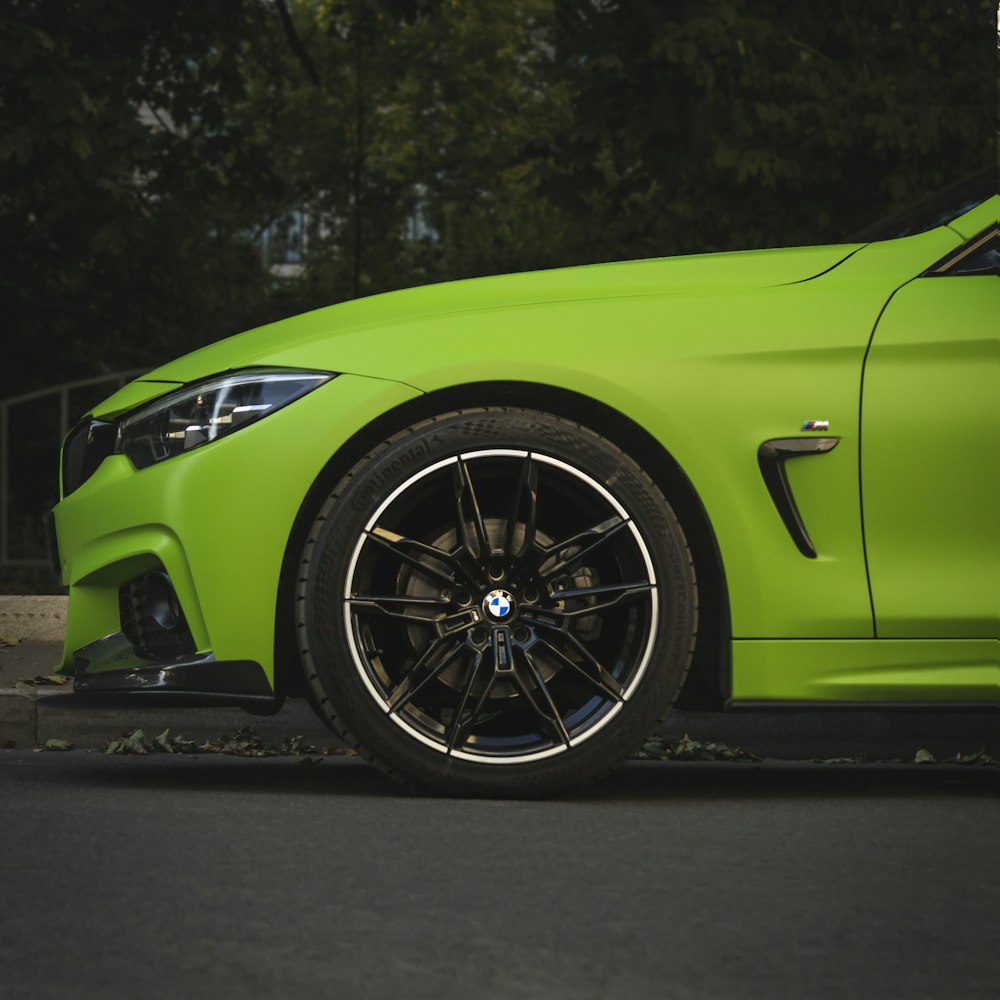 a green car with a black rim