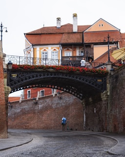 a bridge with a building in the background