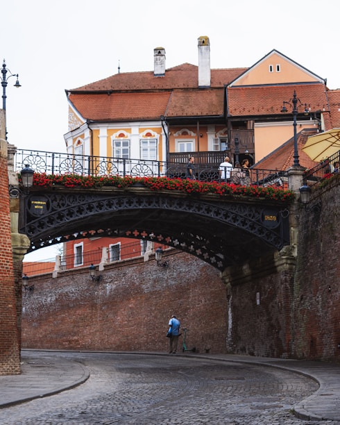 a bridge with a building in the background