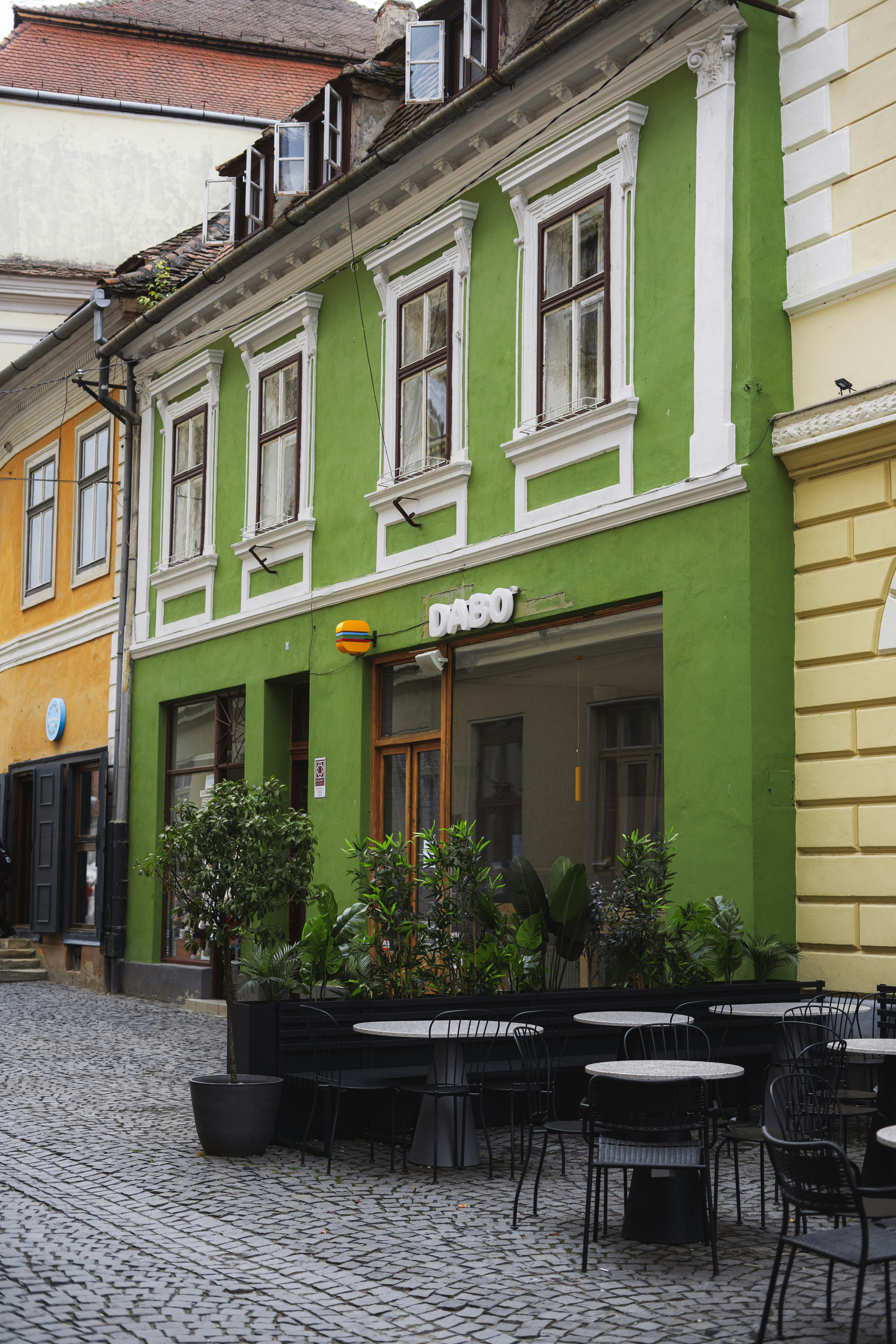 a table and chairs outside a building