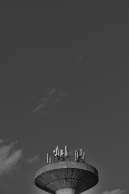 A panoramic shot of the contest station with multiple monitors and antennas visible outside the window.