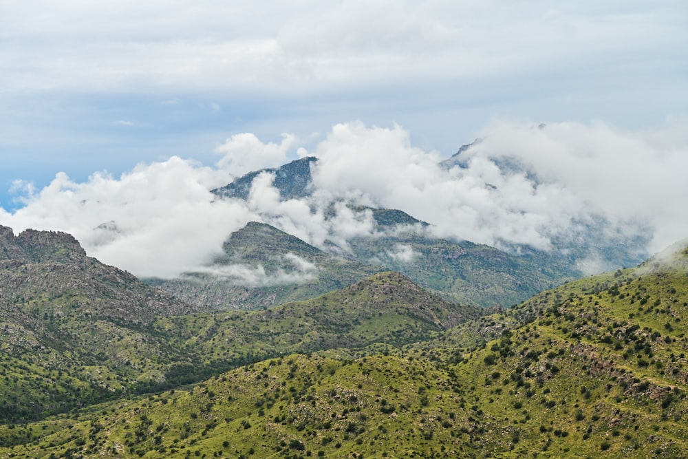 a mountain range with clouds