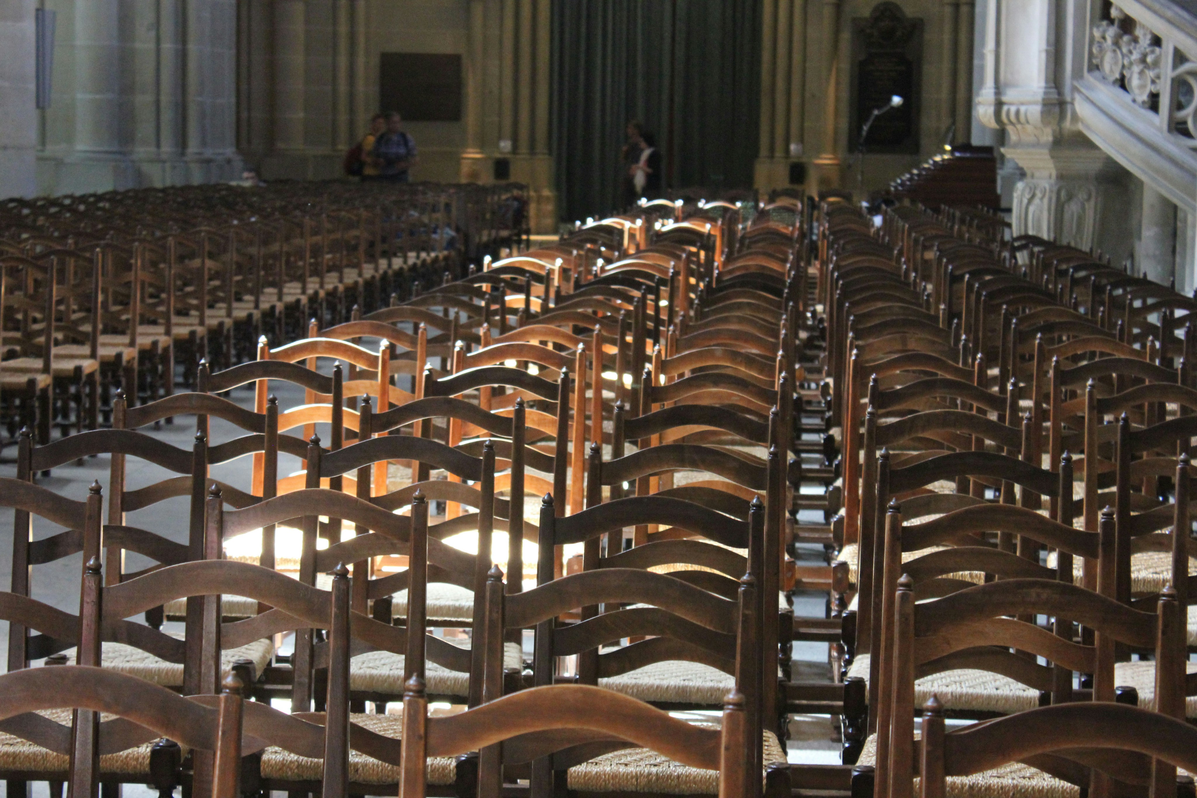 Light rests on chairs in Lausanne Cathedral.
