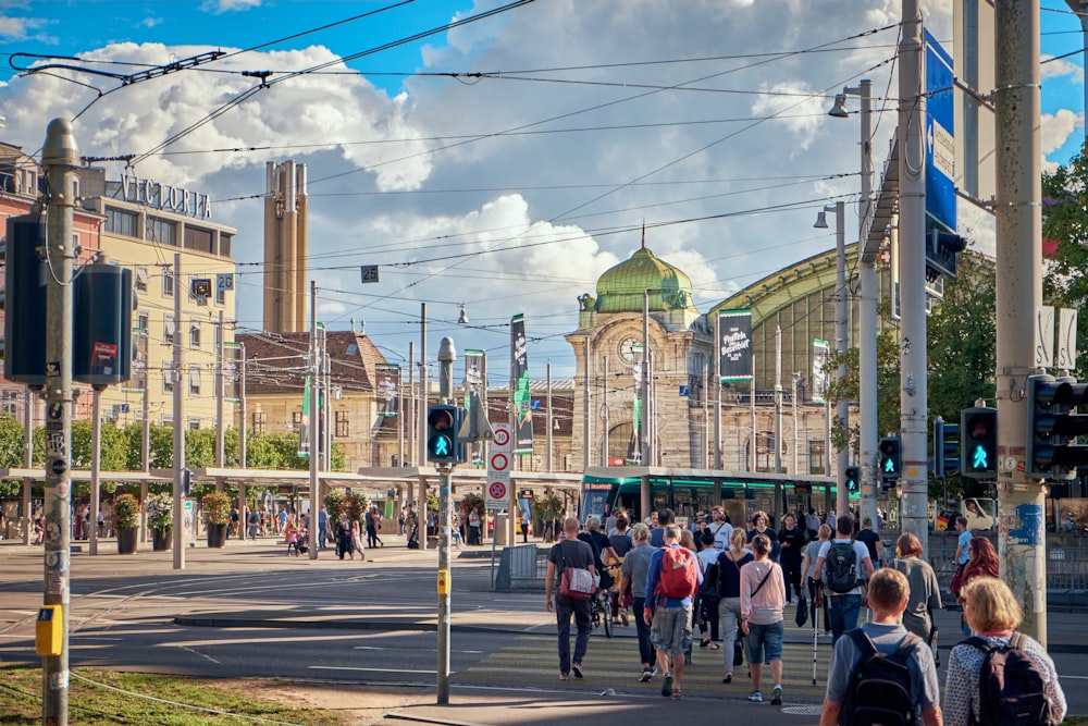 a crowd of people walking on a street