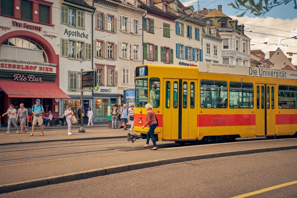 a yellow trolley on the street