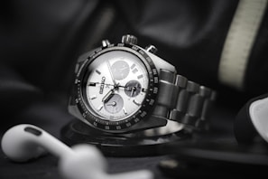 a hand holding a watch