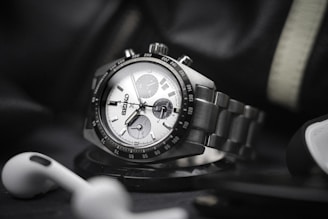 a hand holding a watch