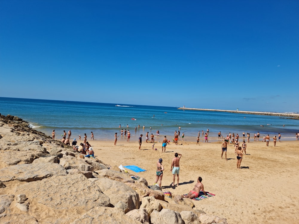 a crowded beach with people