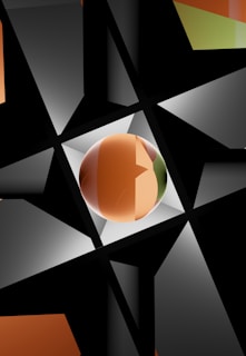 A geometric composition featuring intersecting black triangles and a central, glossy sphere. The sphere exhibits gradient colors ranging from orange to green. The background is a mix of dark and light gray triangles, creating an abstract and dynamic pattern.