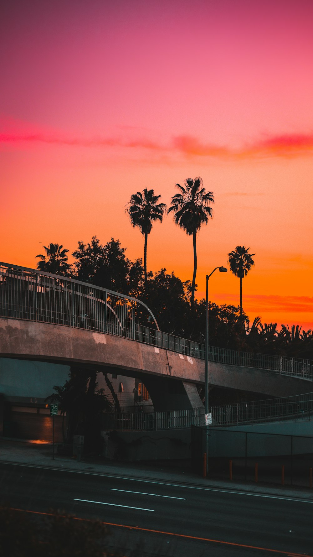 a sunset over a bridge