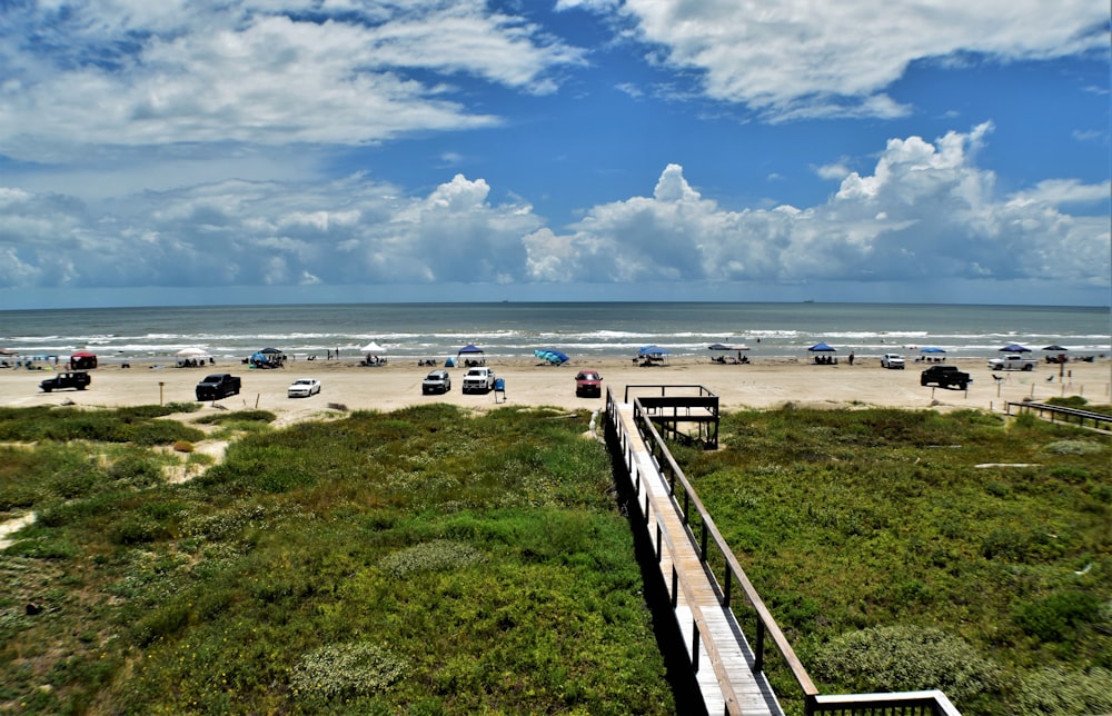 a group of cars parked on a beach