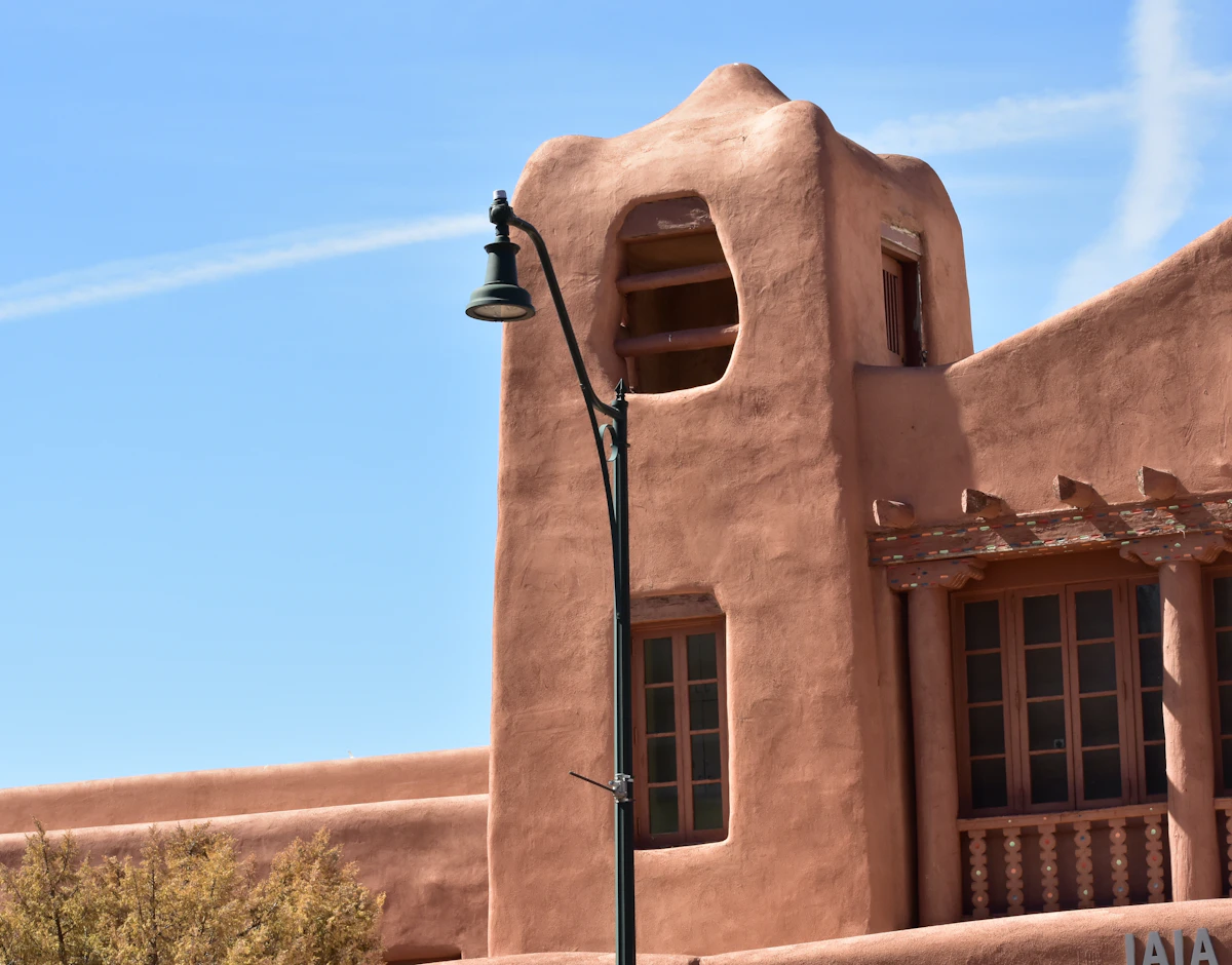 Adobe architecture and a bell opening in Santa Fe