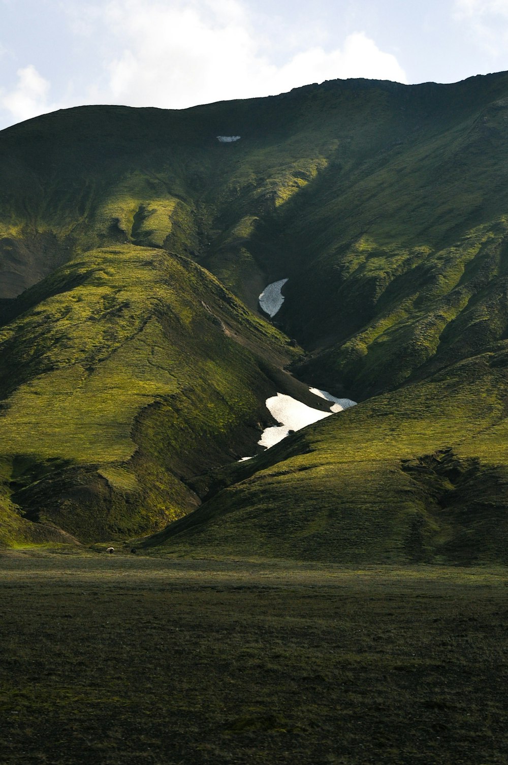 a waterfall in a valley