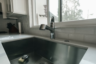 a kitchen sink with a window