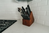 A magnetic knife holder elegantly displayed in a kitchen.
