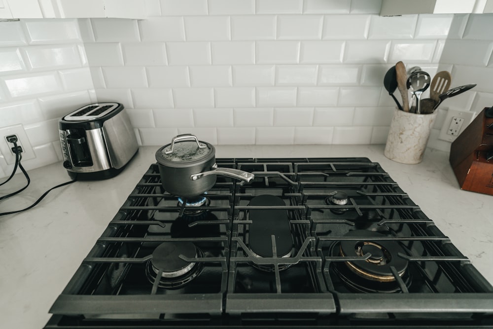 a stove top with pots and pans on it