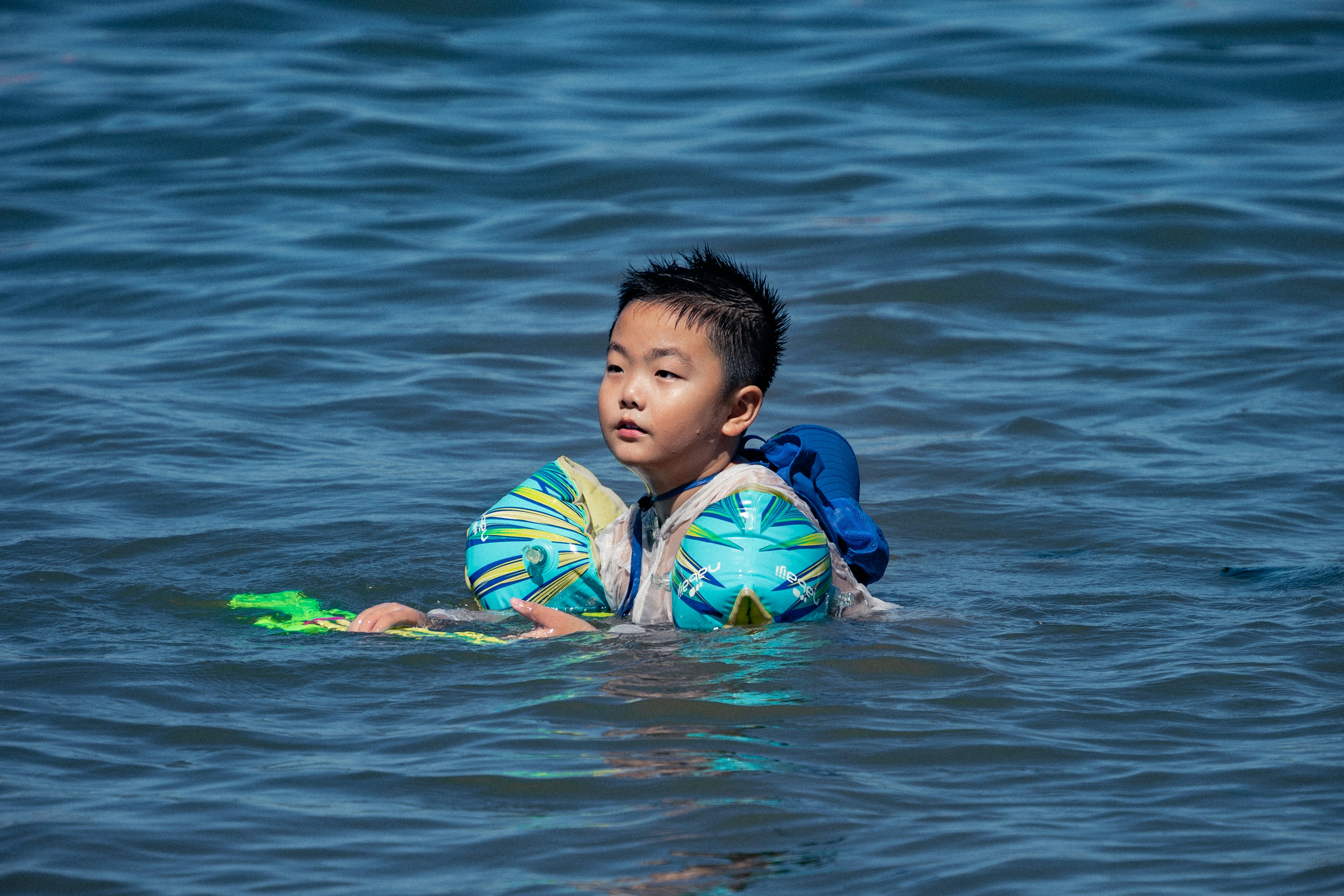 A boy playing with a ball in the water photo – Free Human Image on Unsplash