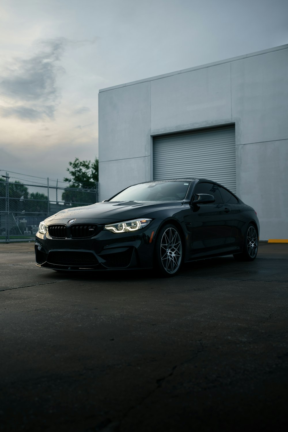 a black car parked in front of a building