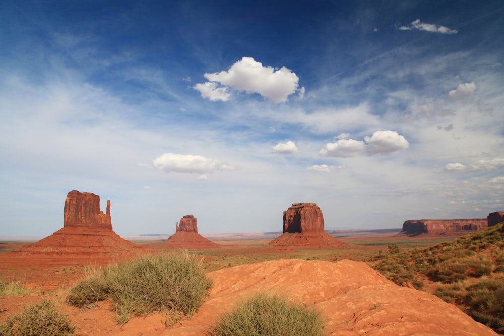 a desert landscape with tall red rock formations