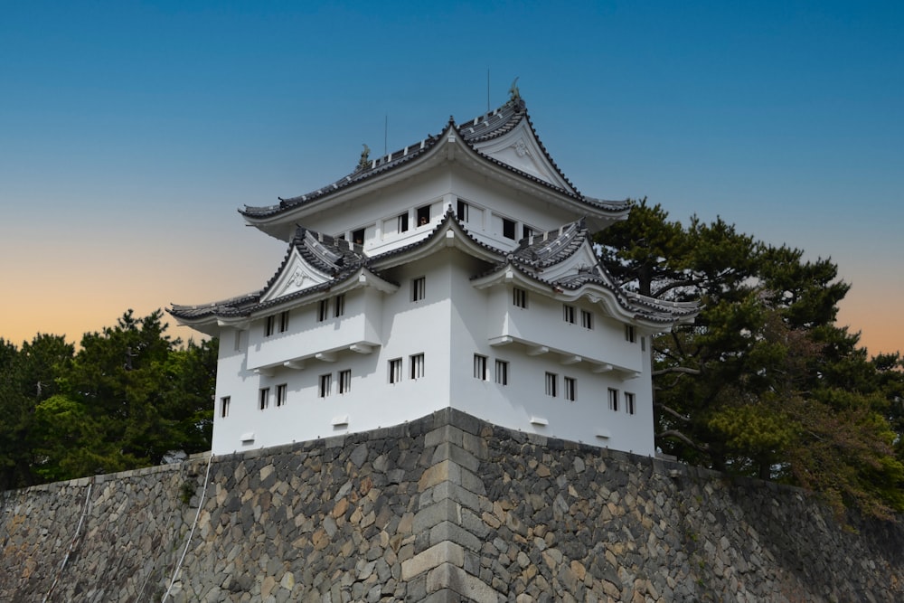 a building with a stone wall