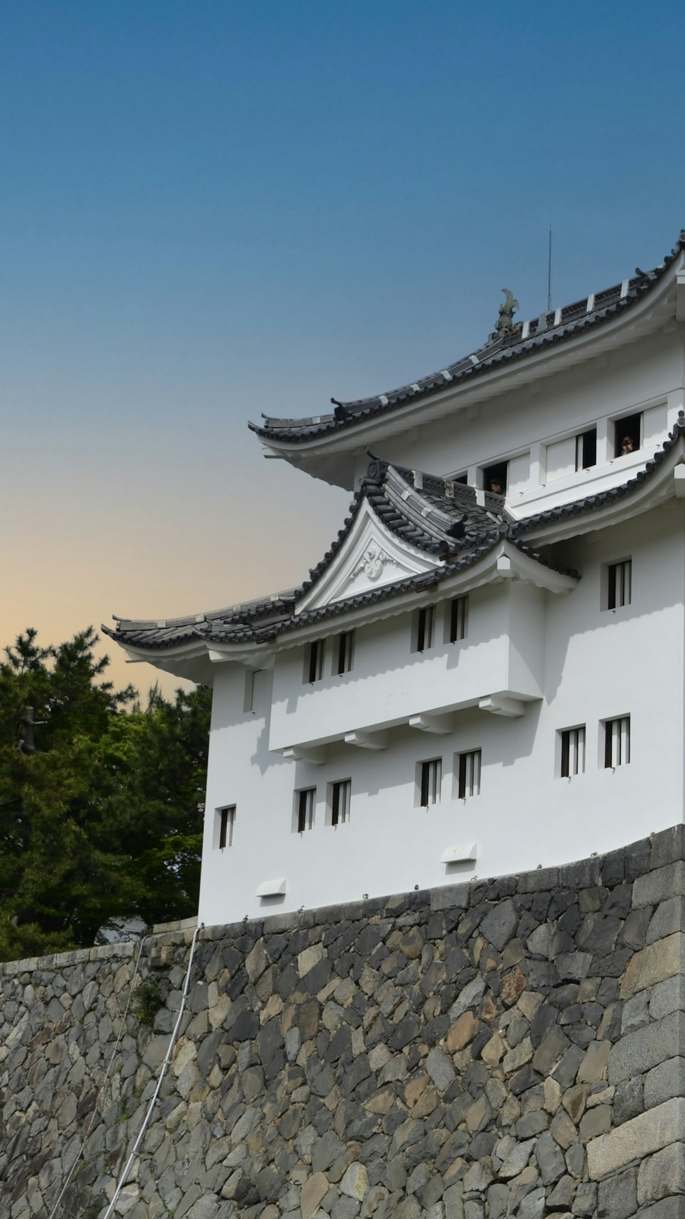 a building with a stone wall