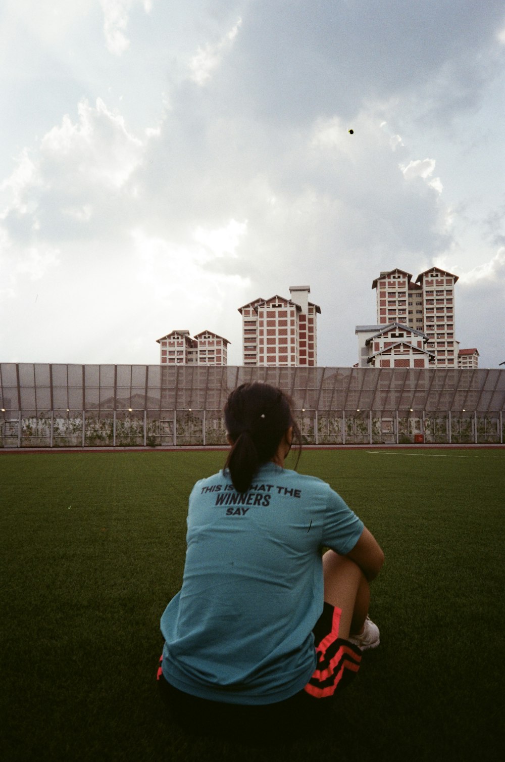 a man sitting on a field