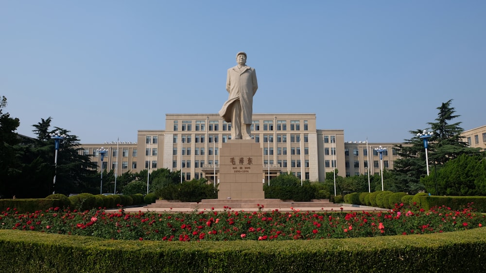 a statue in front of a building