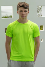 A fit person measuring waist with a tape in neon green lighting.