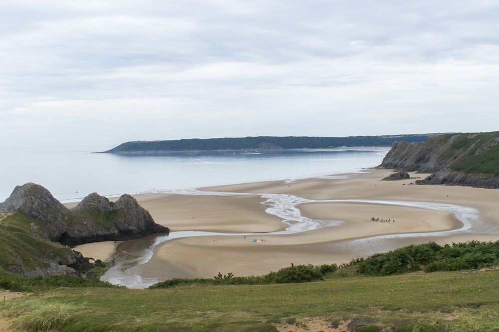 a beach with a body of water