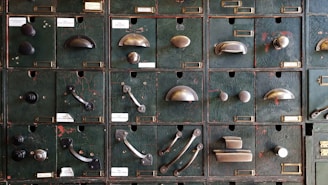 A collection of kitchen cabinet knobs and pulls arranged aesthetically.