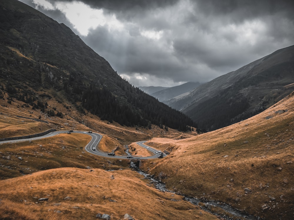 a winding road through a valley