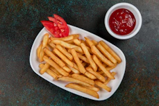 a plate of french fries and sauce