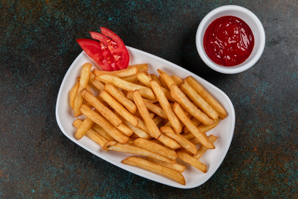 a plate of french fries and sauce