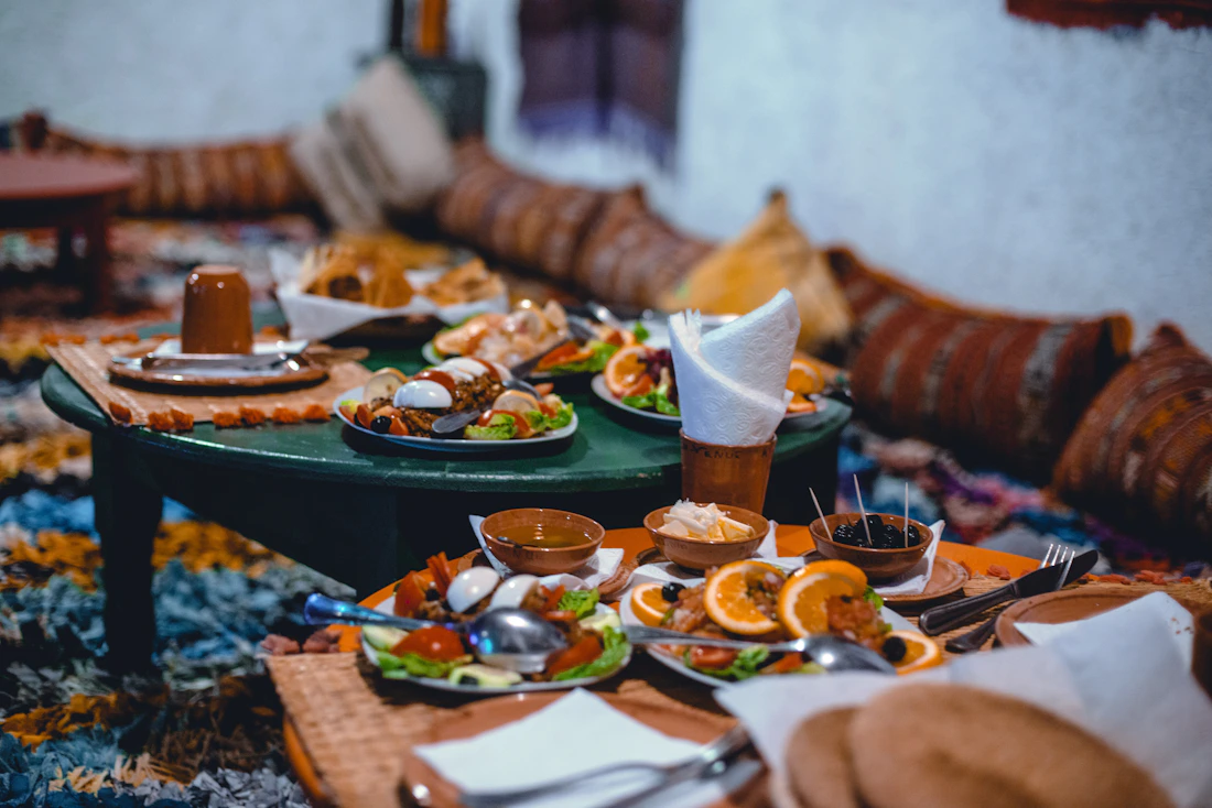 A Moroccan table spread with multiple dishes