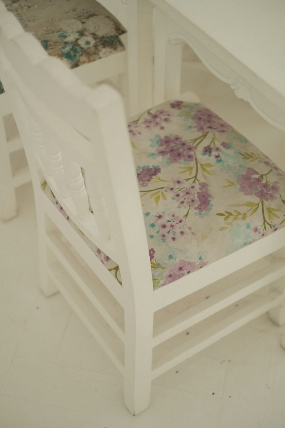 a white crib with a flower pattern