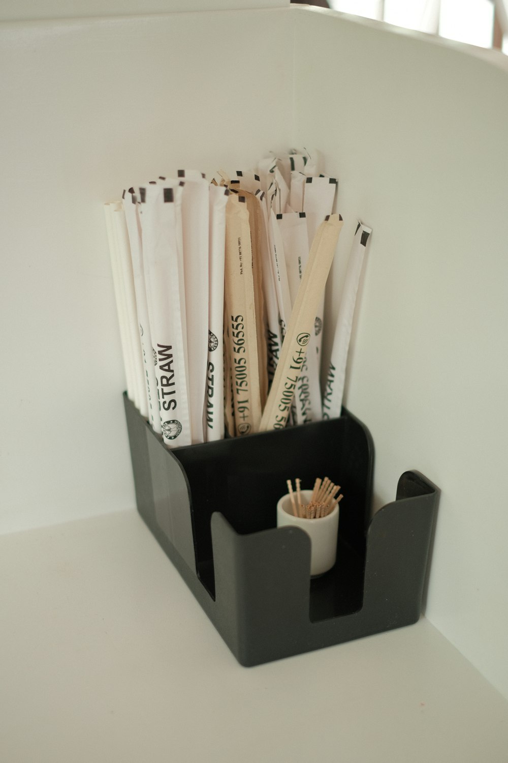 a group of pencils in a holder