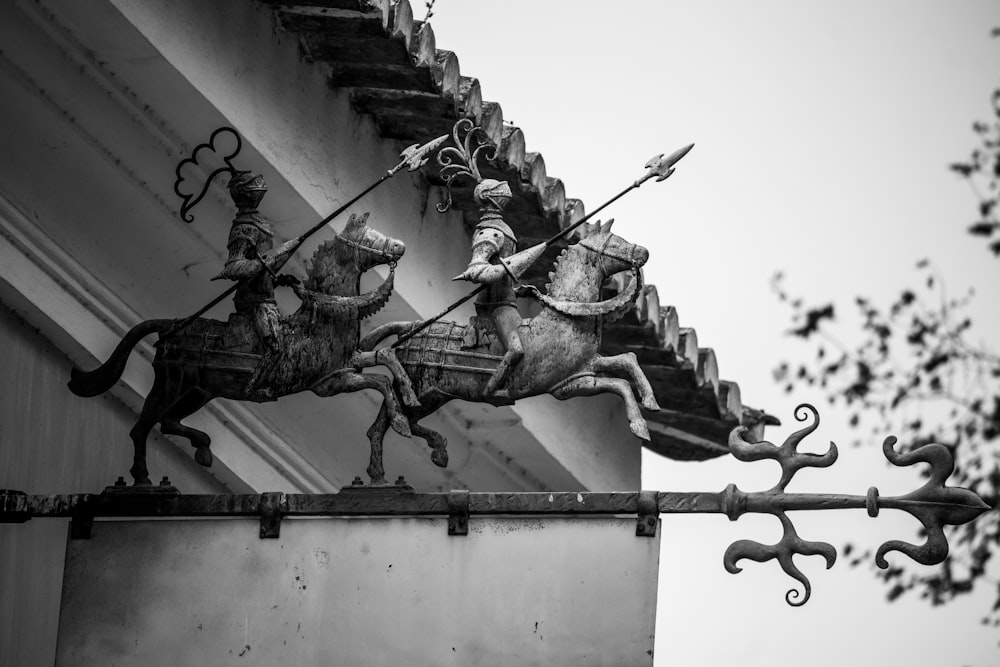 a statue of a person holding a sword