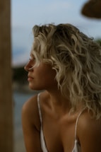 a woman with her hair blowing in the wind
