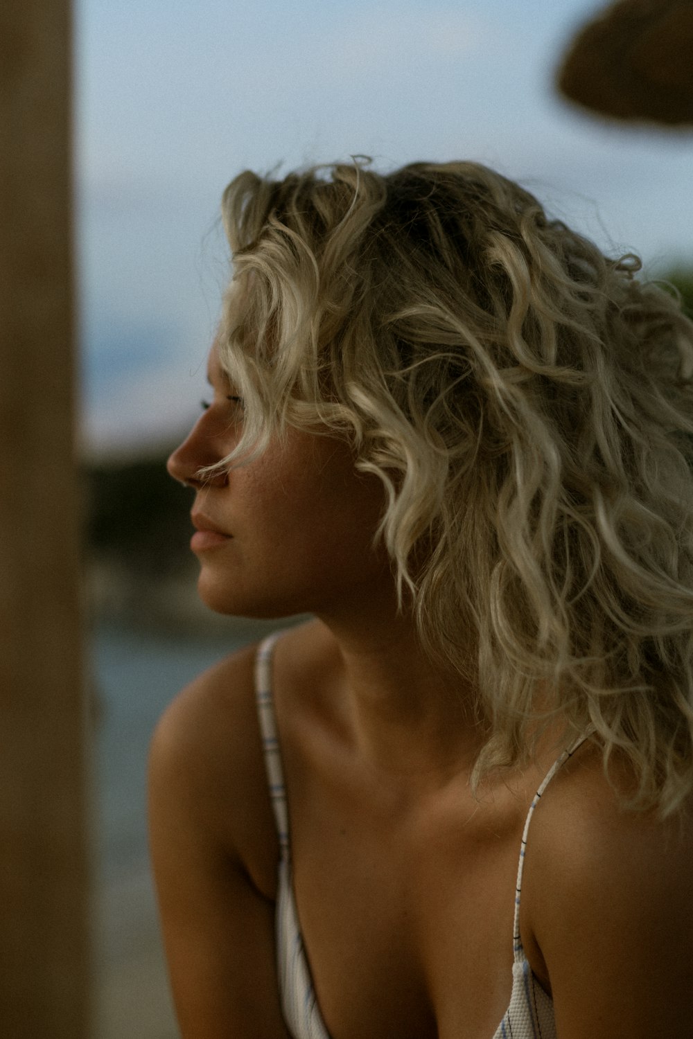 a woman with her hair blowing in the wind